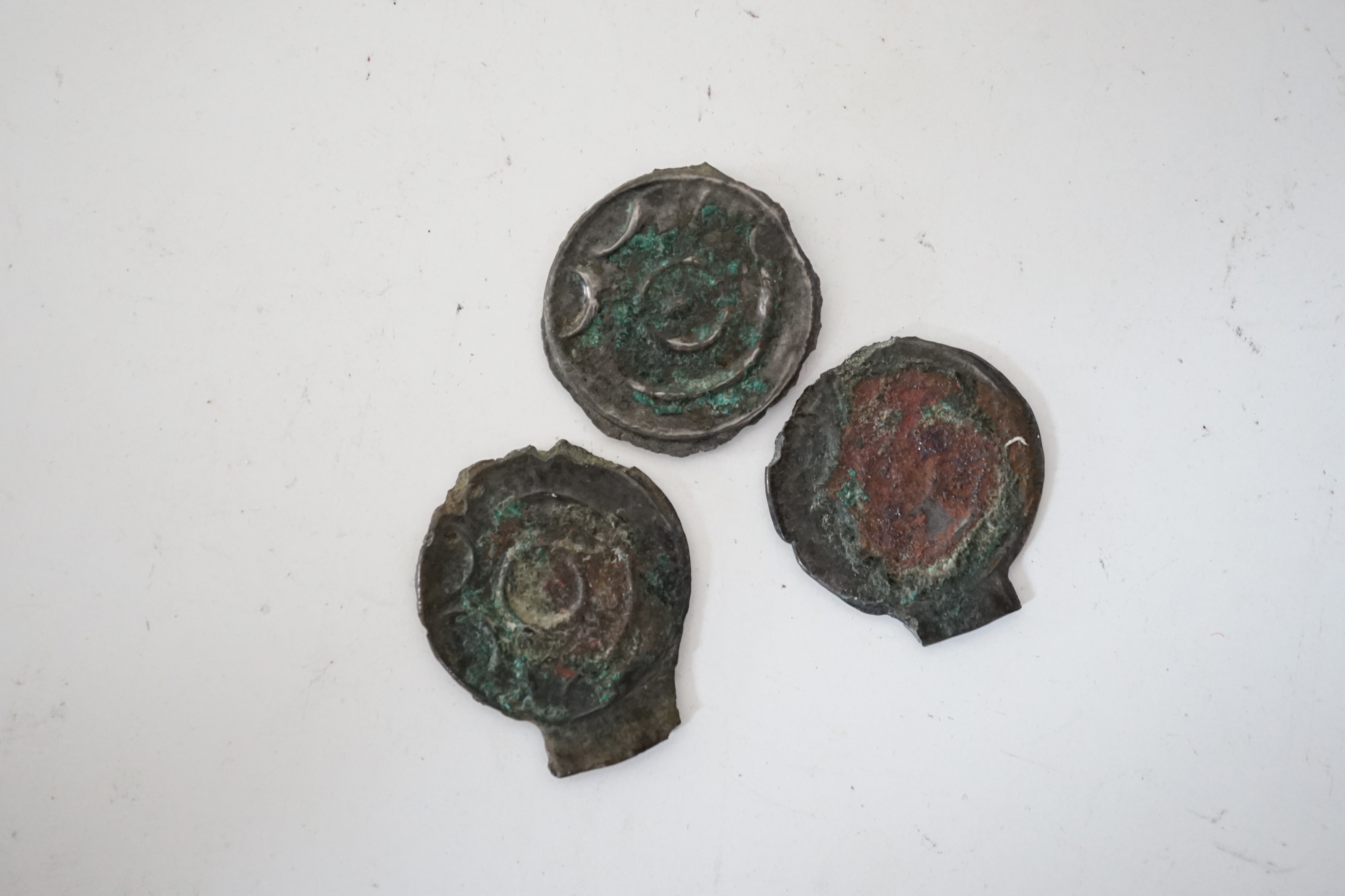 British Celtic coins, three copper/tin alloy potins (S63), stick bull and stick head designs, some encrustation otherwise VF, 1.16 to 1.6g, with label stating that they were found in Warlingham, Surrey